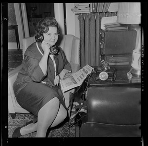 Louise Day Hicks with copy of the Record American announcing her win