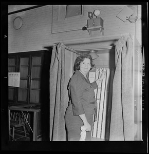 Louise Day Hicks standing in voting booth