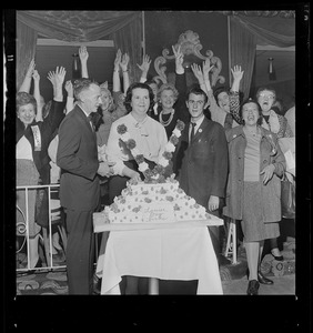 After her overwhelming victory in School Committee fight, Mrs. Louise Day Hicks and husband John, pose with cake at New Boston Club
