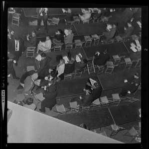 Police officers assist woman having a seizure during President Lyndon Johnson's rally in Post Office Square