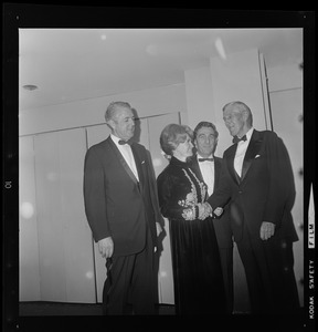 Congresswoman Margaret Heckler and her husband, John, are greeted by former Sen. Leverett Saltonstall during dinner held in her honor at Hotel Somerset