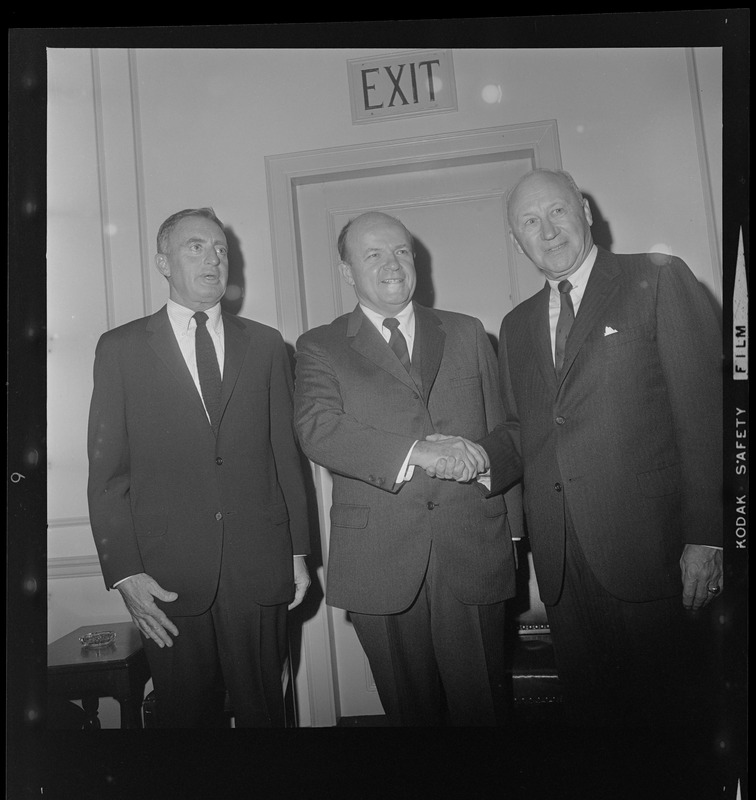 Three unidentified men at the Hotel Somerset for a dinner honoring ...