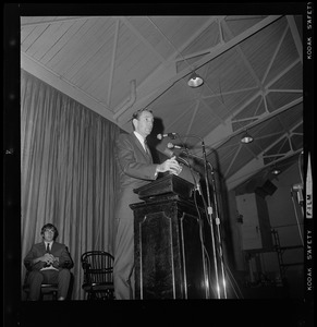 Unidentified man addressing audience at Tufts University