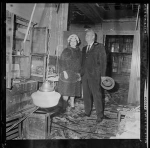 School Committee Chairman Louise Day Hicks and William Ohrenberger view interior of Hyde School damaged by fire