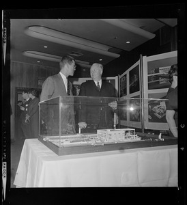 David B. Stone, President of New England Aquarium, and Mayor John Collins look over model of new aquarium to be built on Central Wharf at the foot of State St., overlooking Boston Harbor