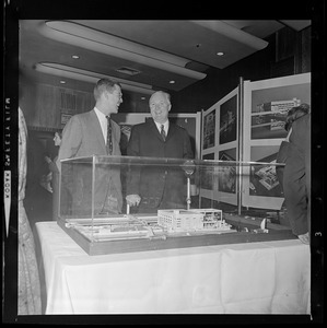 David B. Stone, President of New England Aquarium and Mayor John Collins look over model of new aquarium to be built on Central Wharf at the foot of State St., overlooking Boston Harbor