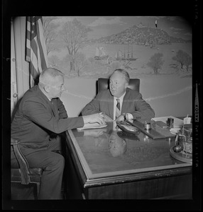 Boston Mayor John Collins in his office with unidentified man