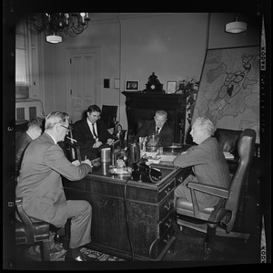 Boston Mayor John Collins in his office with unidentified men