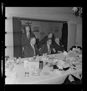 Mark Francis Collins, seated center, with unidentified men at party for Harold G. Kern