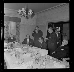 Group of men, including Mark Francis Collins, seated center, at party for Harold G. Kern