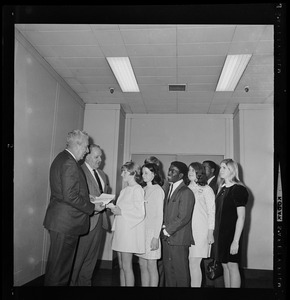 Boston police and school department officials salute seven young individuals for meritorious acts by presenting them with savings bonds. From left, School Supt. William Ohrenberger, Police Comr. Edmund McNamara, Ellen Bolingbroke, Wanda Woodworth, Gary Galinos, James Cody, Judith Alman, Edward Lewis, and Rosemary Dorr