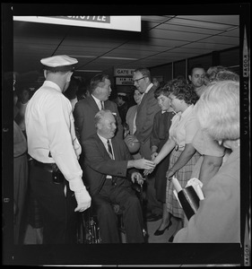 Mayor John F. Collins is warmly greeted at Logan International Airport, East Boston, on his return from Houston, Tex., where he was elected president of American Municipal Assn.