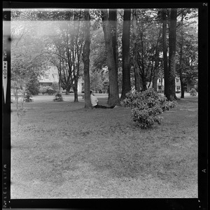 Sen. Birch Bayh sitting under a tree on hospital grounds after air crash