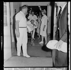 Marvella Hern Bayh leaving the hospital on a stretcher