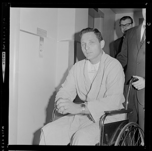 Sen. Birch Bayh being wheeled into the press conference regarding the fatal plane crash he survived