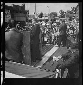 George Wallace speaking from podium at outdoor campaign rally
