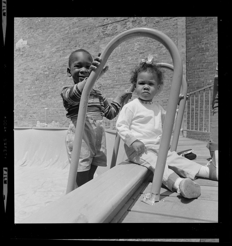 Two children at empty above-ground pool