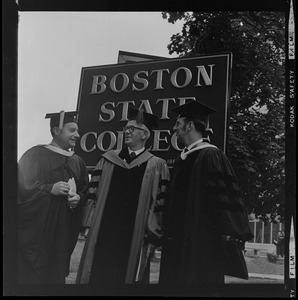 Dr. John J. O'Neill with two other men in academic regalia in front of Boston State College sign