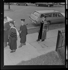 Dr. John J. O'Neill with three other men in academic regalia at his formal inauguration as president of Boston State College