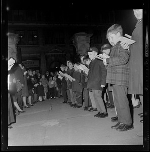 Children singing at City Hall Christmas lighting ceremony