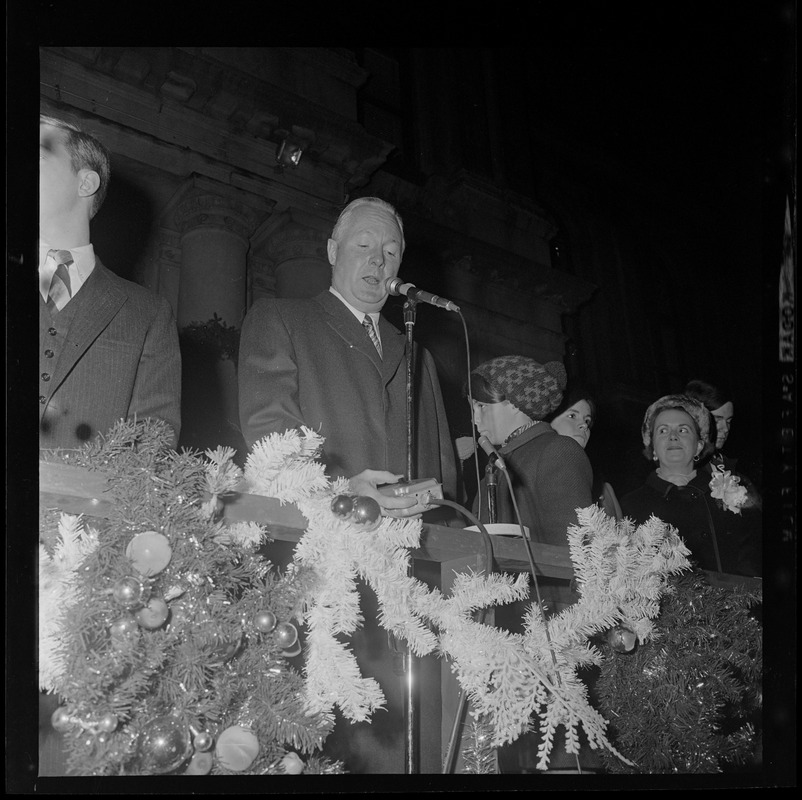 Mayor John F. Collins with switch to illuminate Christmas lights at City Hall