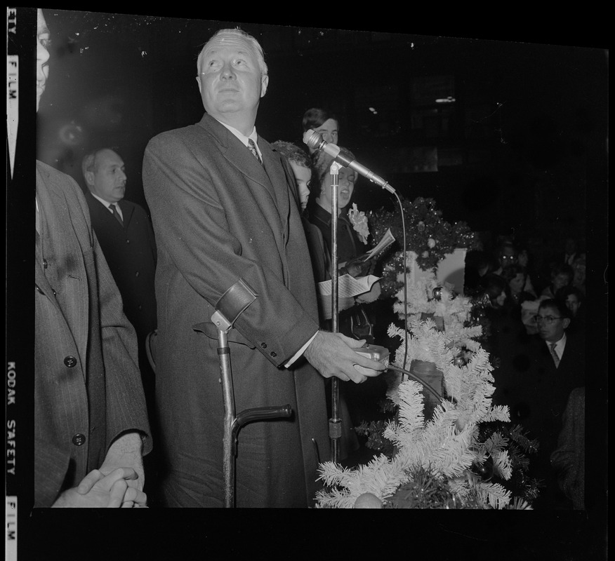 Mayor John F. Collins with switch to illuminate Christmas lights at City Hall