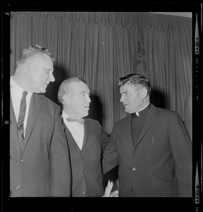John Yauckoes, Frank Leahy, and Msgr. George Kerr at dinner in honor of the 1941 Boston College Sugar Bowl team