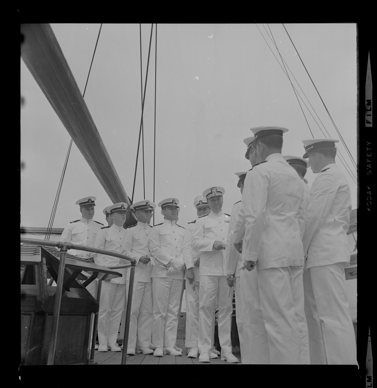 Rear Admiral Joseph C. Wylie with 16 Tufts ROTC graduates aboard Old Ironsides