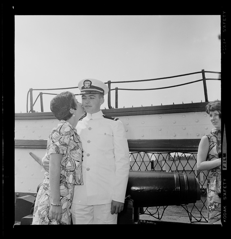 Tufts Naval ROTC graduate receives kiss at commissioning ceremony aboard Old Ironsides