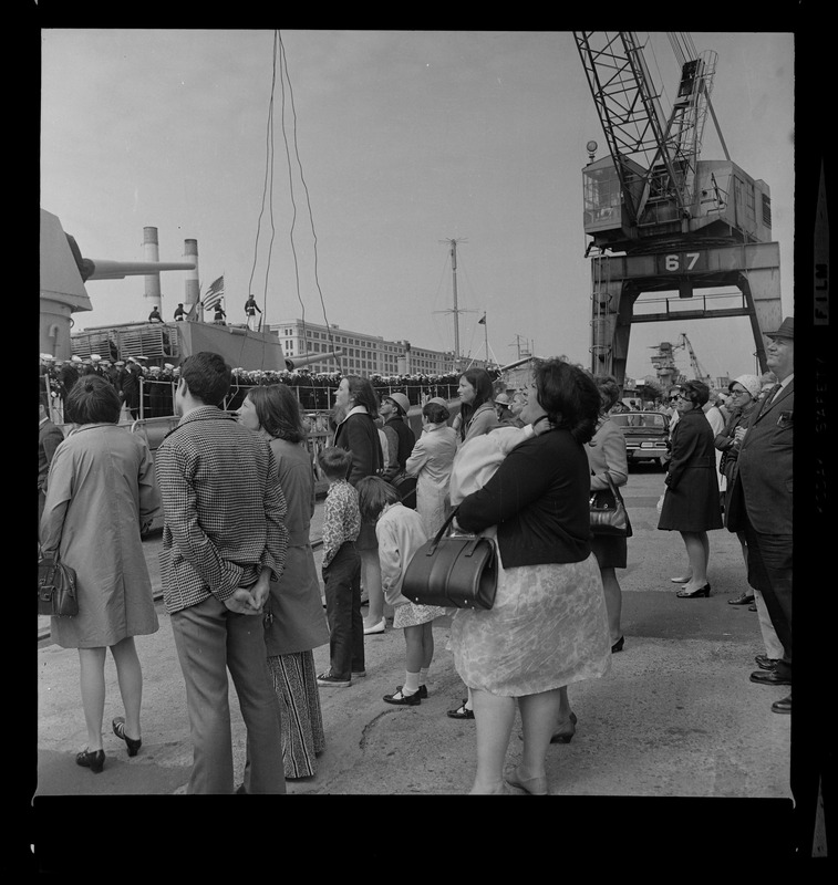 Crowd of people at South Boston Naval Annex bidding the USS Boston farewell as it leaves for tour of duty in Vietnam