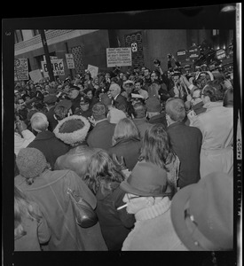 Dr. Benjamin Spock surrounded by protesters outside the Federal Building in Boston after his arraignment on charges of aiding draft resisters