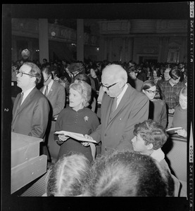 William Sloane Coffin, Jane Spock, and Dr. Benjamin Spock at anti-draft rally at Arlington Street Church