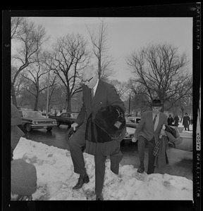 Dr. Benjamin Spock and Mitchell Goodman arriving at Arlington Street Church for anti-draft rally