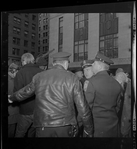 Protesters and police outside the Federal Building in Boston after arraignment of "Boston Five" on charges of aiding draft resisters