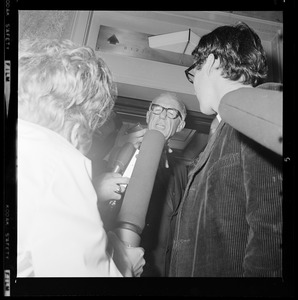 Pediatrician Dr. Benjamin Spock talking with reporters after being found guilty of anti-draft conspiracy charges in "Boston Five" trial