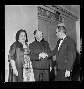 Lucia Vollono, Executive State Director of Boys' Towns, Msgr. John Patrick Carroll-Abbing, and Edward J. Tedesco, dinner chairman, at a dinner held in Carroll-Abbing's honor