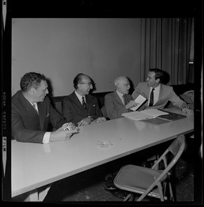 Unidentified man, Dr. Michael DeBakey, Dr. Paul Dudley White, and Dr. Christiaan Barnard during symposium at Boston Museum of Science