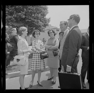 Dr. Christiaan Barnard, second from right, talking with a group outside of Boston Museum of Science