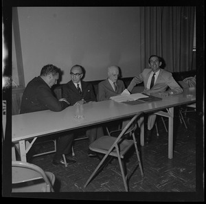Unidentified man, Dr. Michael DeBakey, Dr. Paul Dudley White, and Dr. Christiaan Barnard during symposium at Boston Museum of Science