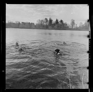 Students in Lake Waban, possibly including two Harvard infiltrators, after the Wellesley College Hoop Roll