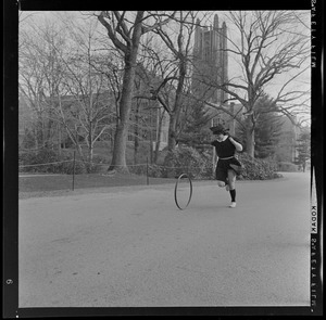 Diana Chapman chasing a hoop in the Wellesley College Hoop Roll