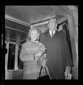 Famed baby doctor, Benjamin Spock, accompanied by his wife, at Federal Building where he and four others went on trial on charges of conspiring to "counsel, aid and abet" young men in resisting the draft