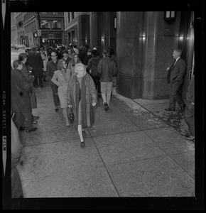 Pickets sympathetic with Dr. Spock and other defendants march outside Boston's Federal Building