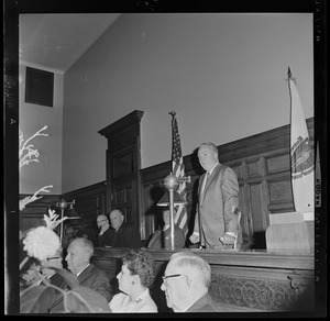 Judge John V. Mahoney, Judge Robert G. Wilson, Jr., and Sen. Leverett Saltonstall watch as Boston Mayor John Collins addresses courtroom during celebration of Wilson's 25th anniversary as member of Suffolk Probate Court bench