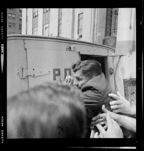 Josef Mlot-Mroz being pushed into a police truck outside the Federal Building, Boston, during demonstration to support the "Boston Five"