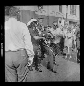 Josef Mlot-Mroz being physically removed from demonstration outside the Federal Building during the sentencing of the "Boston Five"