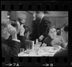 Four people sitting at a table with F. Lee Bailey and Froma Portney in a cafeteria