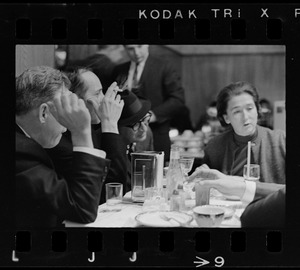Four people sitting at a table with F. Lee Bailey and Froma Portney in a cafeteria