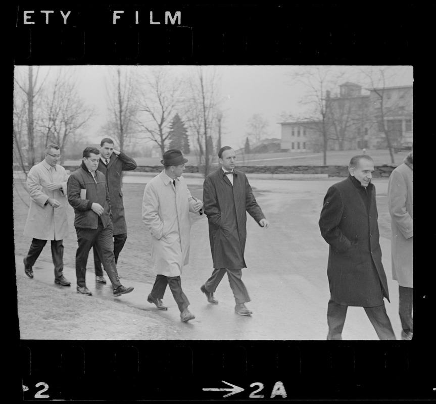 Dr. Robert Mezer and unidentified men walking across Bridgewater State Hospital grounds