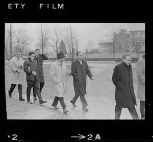 Dr. Robert Mezer and unidentified men walking across Bridgewater State Hospital grounds